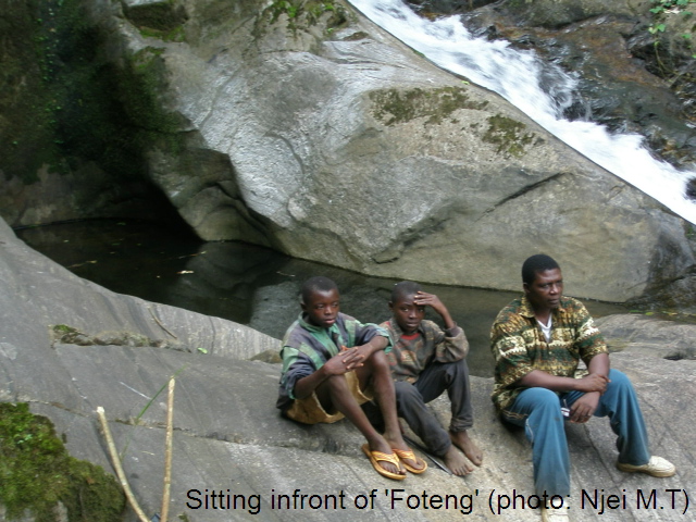 Sitting infront of 'Foteng' (photo: Njei M.T)